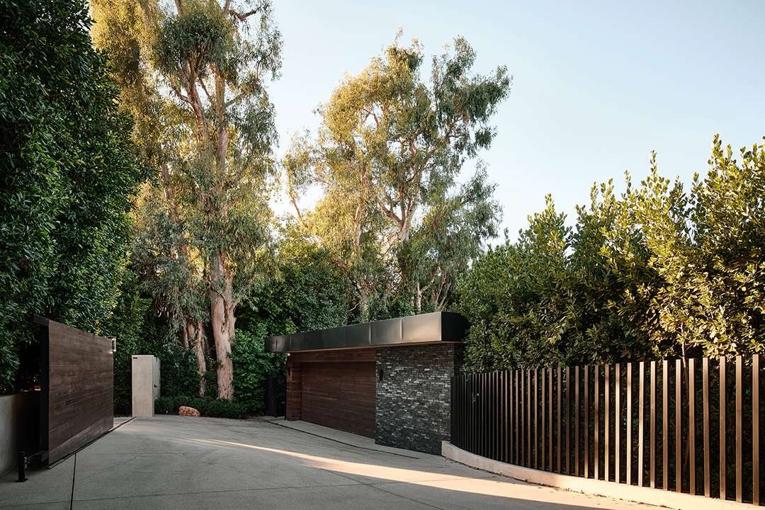 Lizzo's driveway with wood and tiled garage