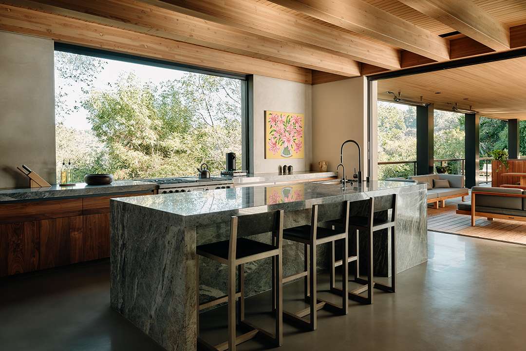 Lizzo's outdoor kitchen with marble island and counters