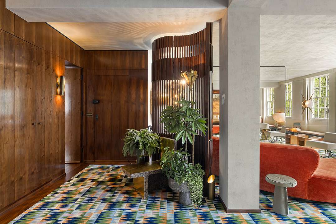 Wood walls and colorful carpet