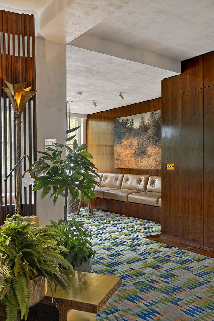 Colorful carpet in wood accented room