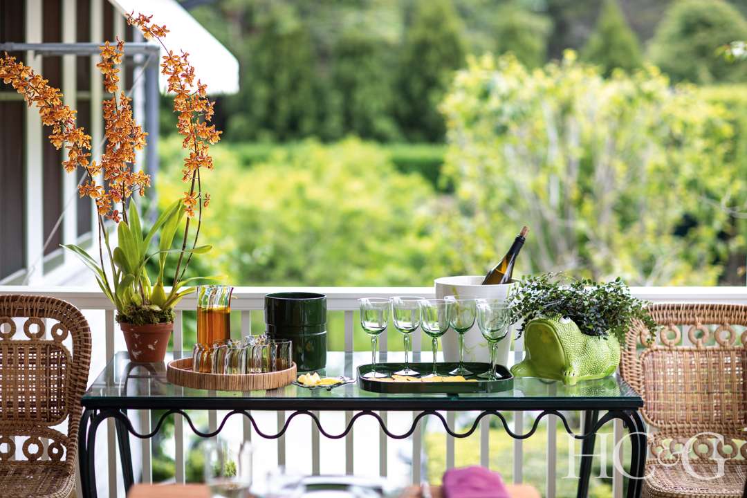 Bar area at the end of porch features green stemware