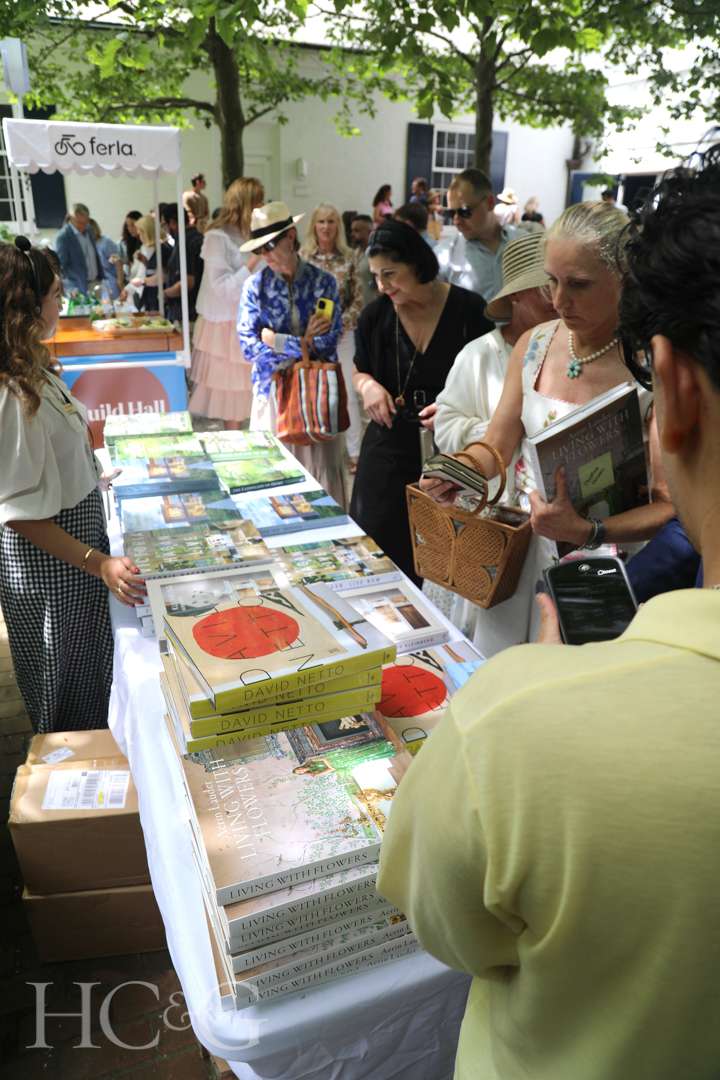 Guests with coffee table books at East Hampton Art & Design Days
