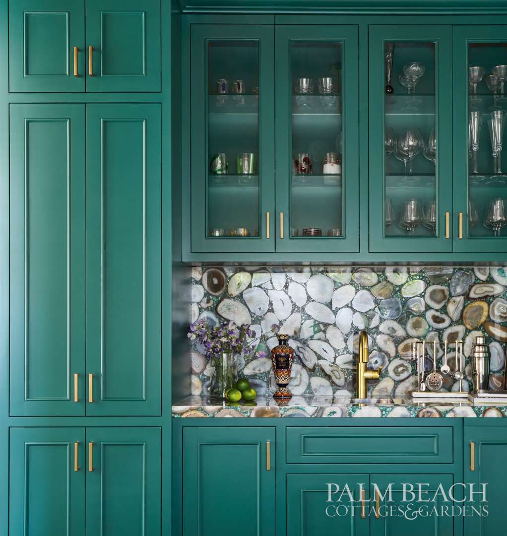 A Palm Beach home's built-in cabinetry coated in Benjamin Moore's Brazilian Rainforest