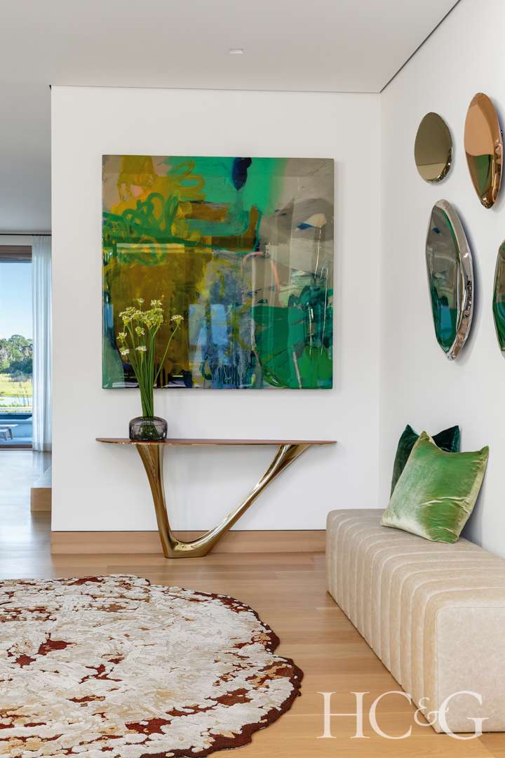 A transitional space decorated with modern pieces of art