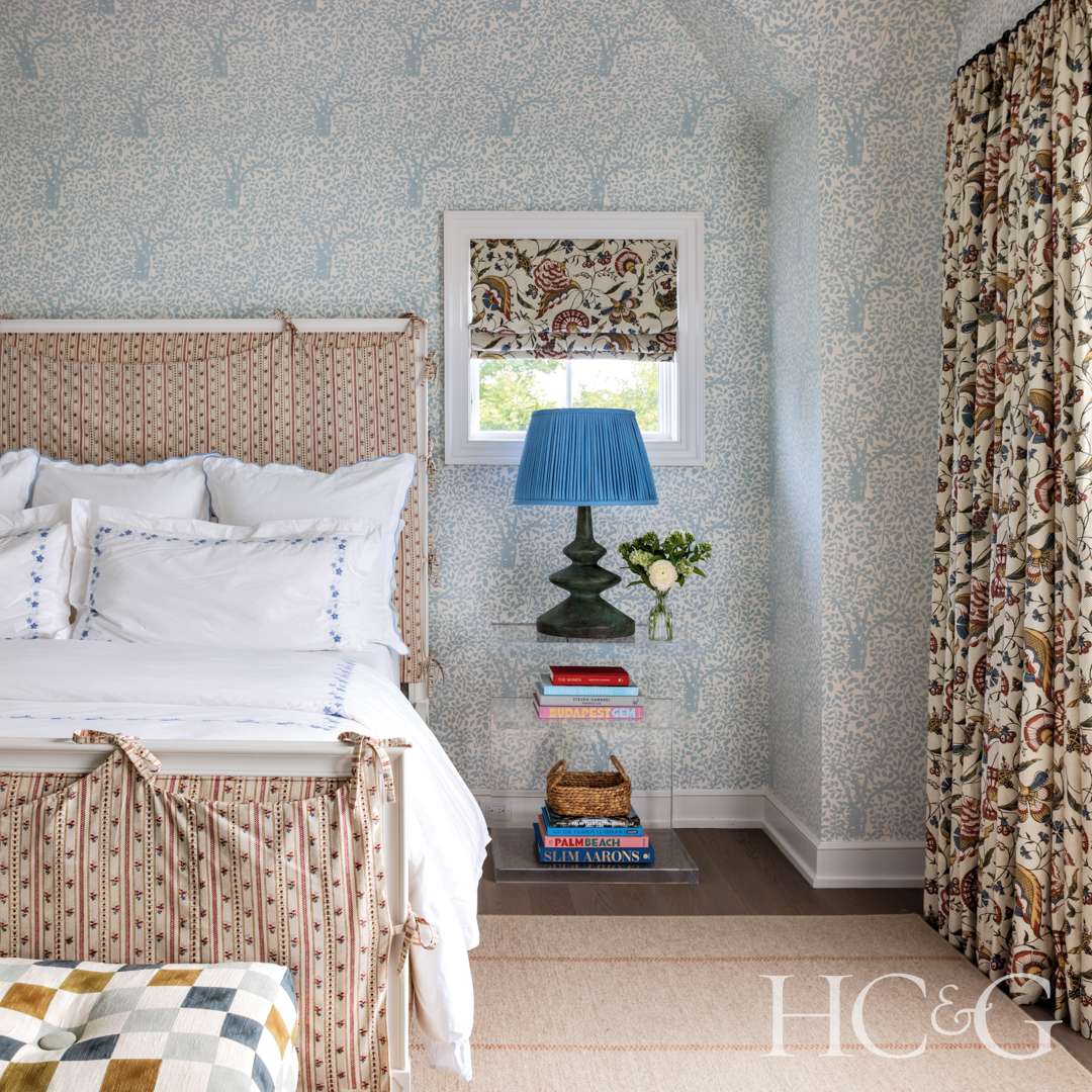 Wallpapered bedroom with blues