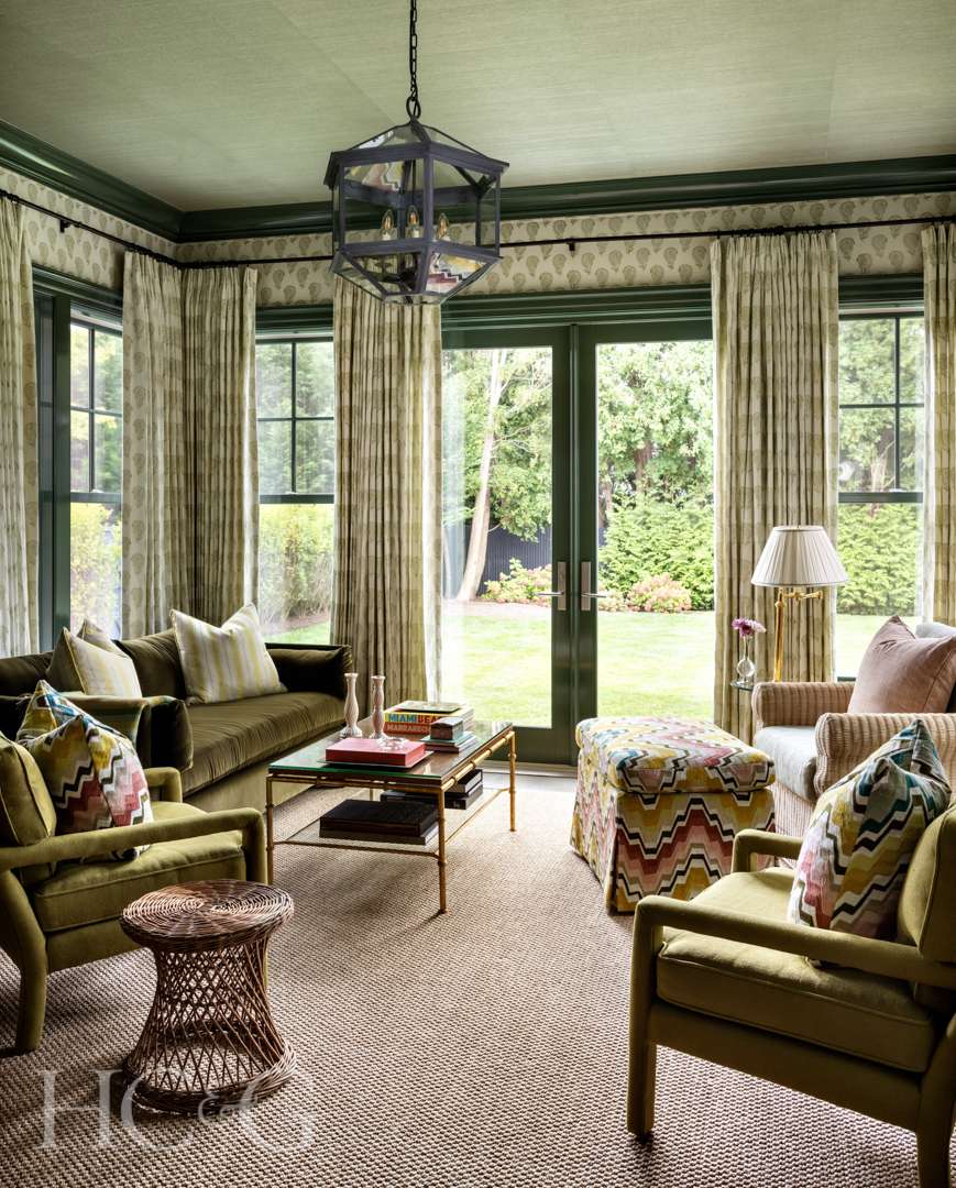 Green pickle ball-inspired sitting room with luxe interiors