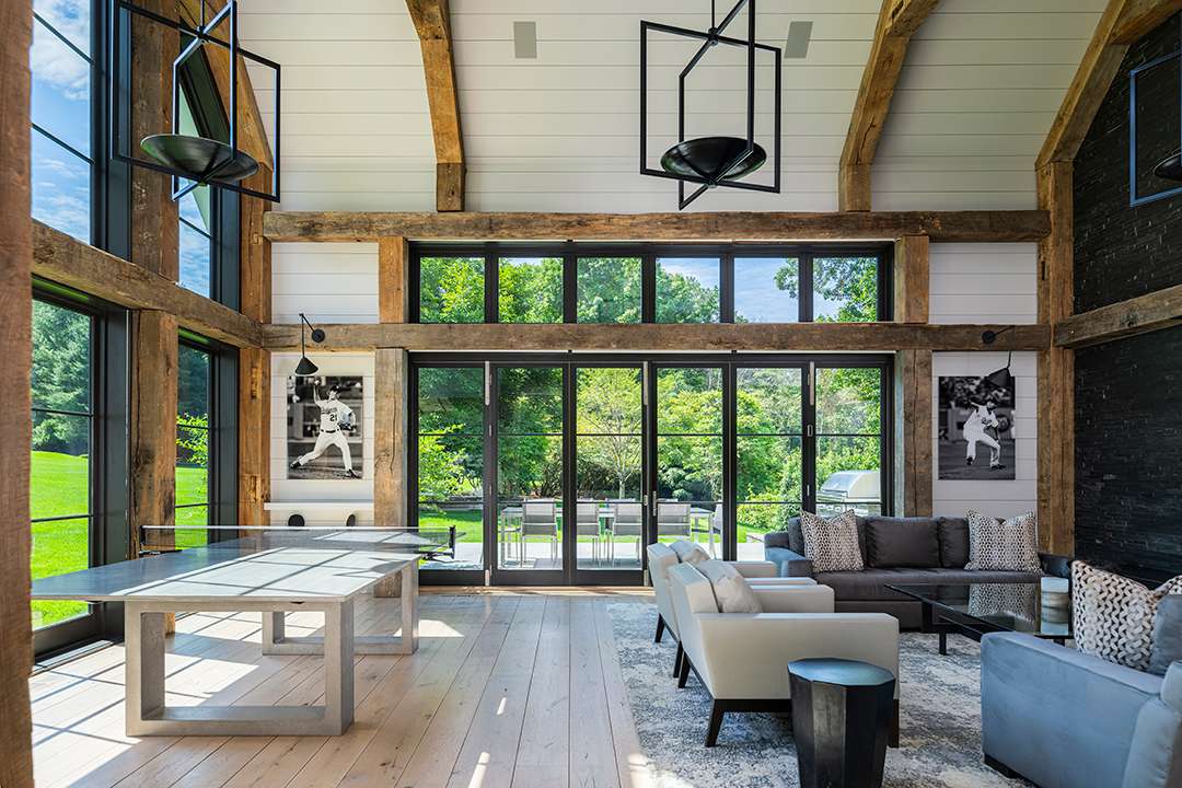 Todd Boehly's rustic, exposed wood beam living space with accents of baseball decor