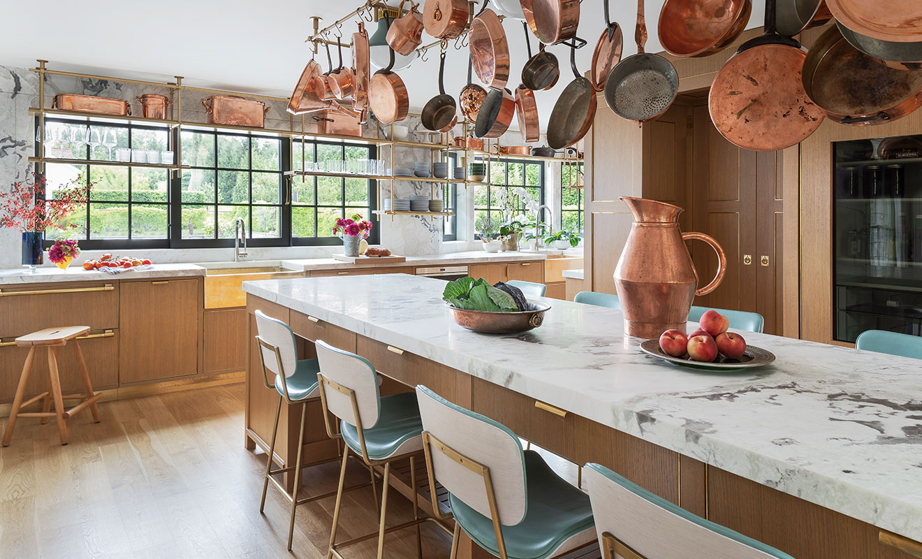 A Chef’s Oasis Showcasing Brass Details and Copper Cookware