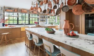 A Chef’s Oasis Showcasing Brass Details and Copper Cookware