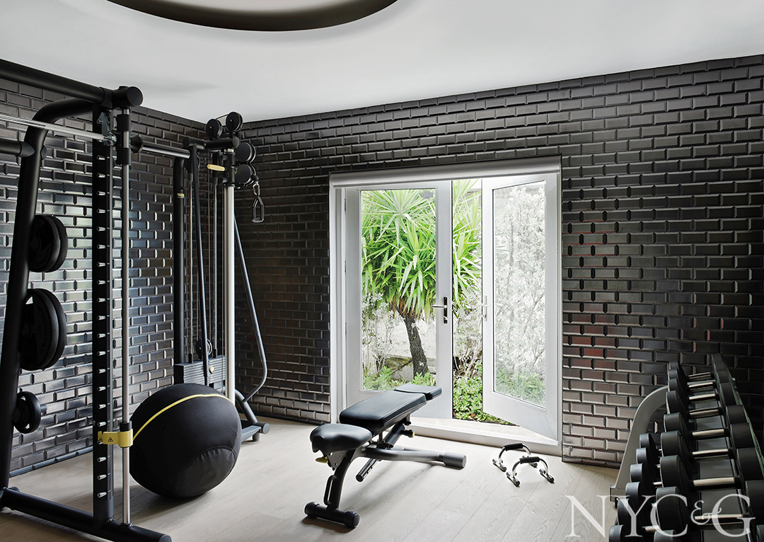 Tile covered wall in home gym