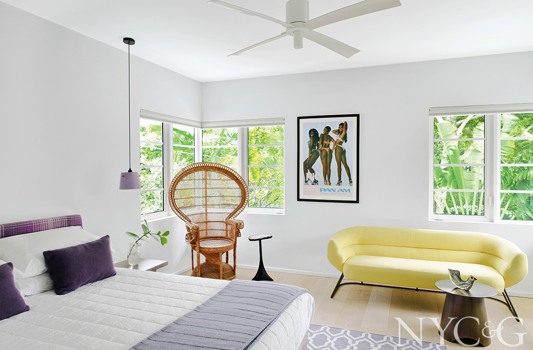 Playful guest bedroom with a vintage wicker peacock chair