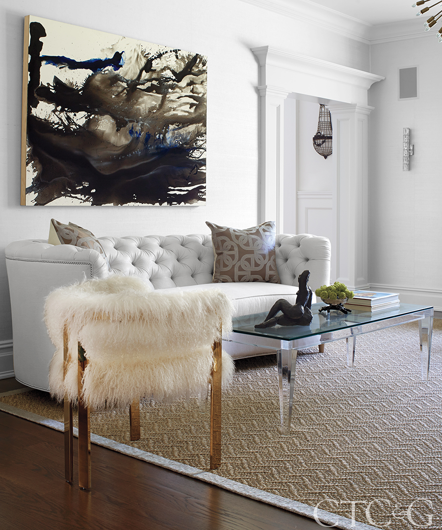 Living room with Mongolian fur chair and grey sofa