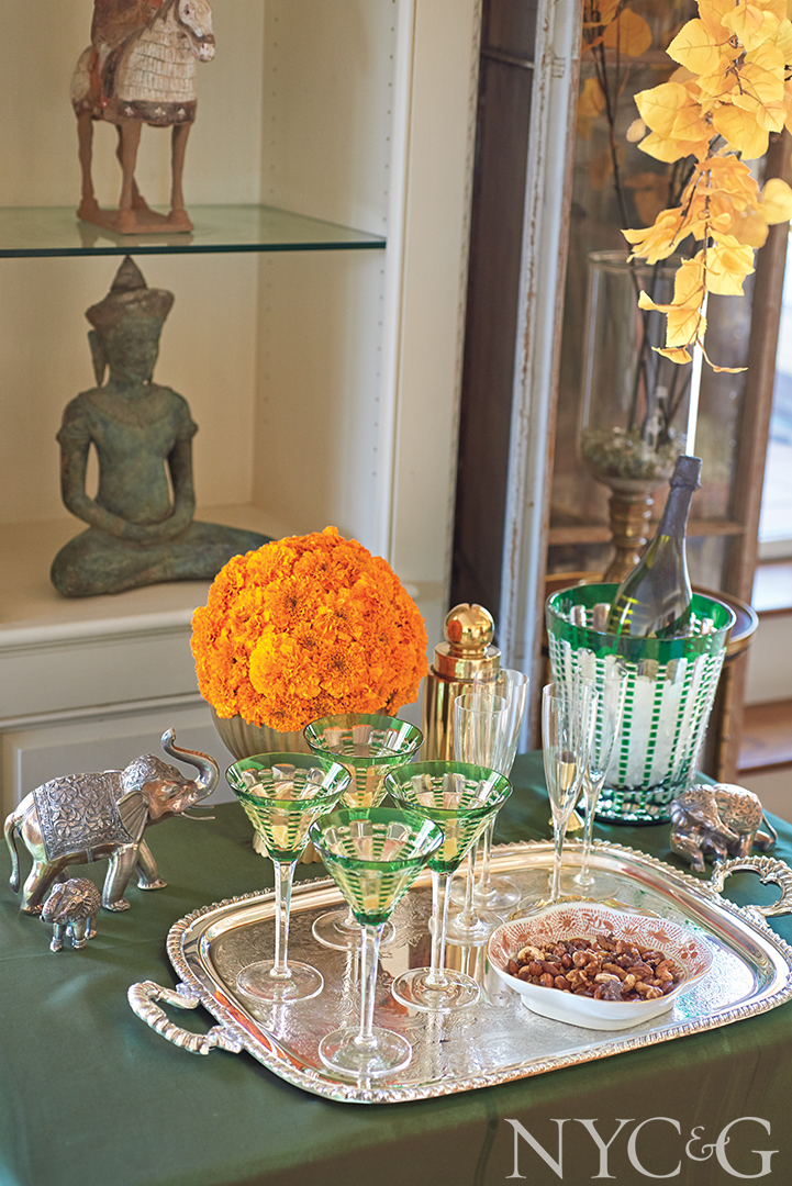 Chic champagne bucket and martini glasses on a bar