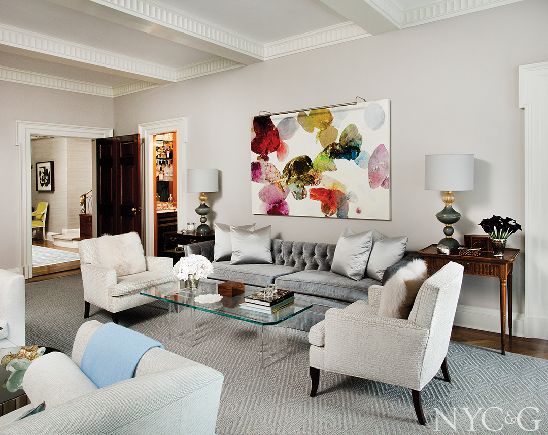 Tasteful living room with a glass and Lucite cocktail table