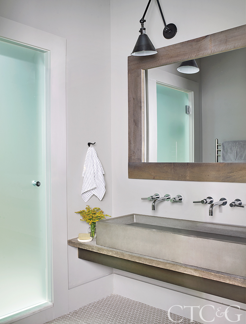 Bathroom with steel sink and wood accents
