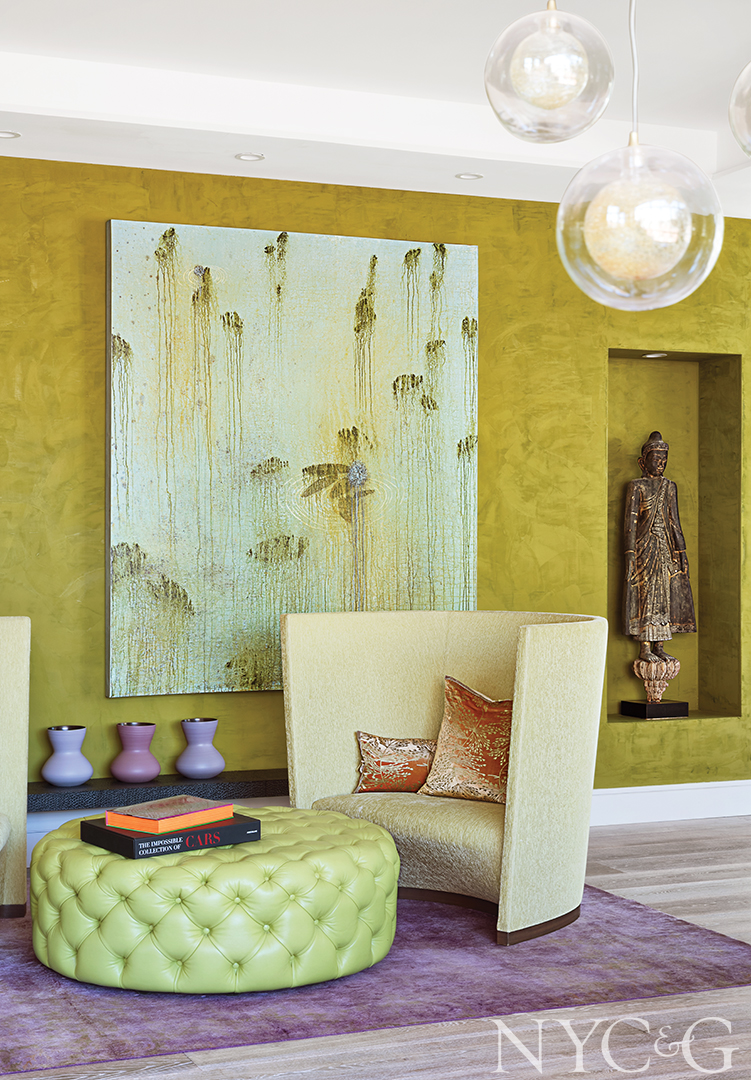 Green leather ottoman adds texture to living room