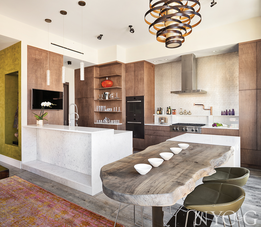 Walnut cabinetry fill this contemporary kitchen