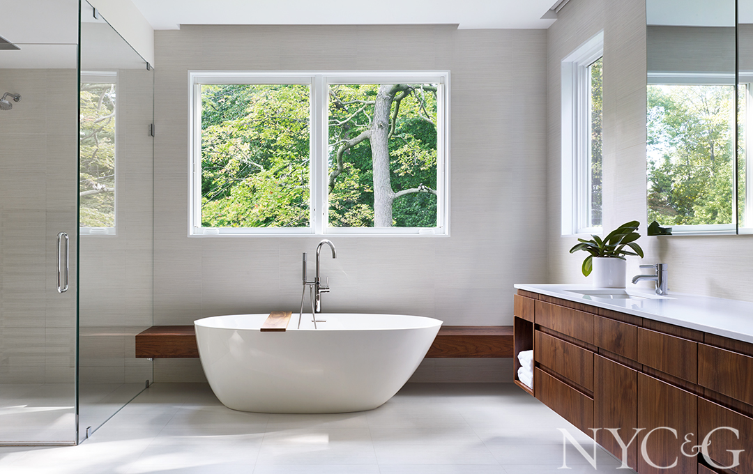 Sun-lit master bathroom with walnut accents