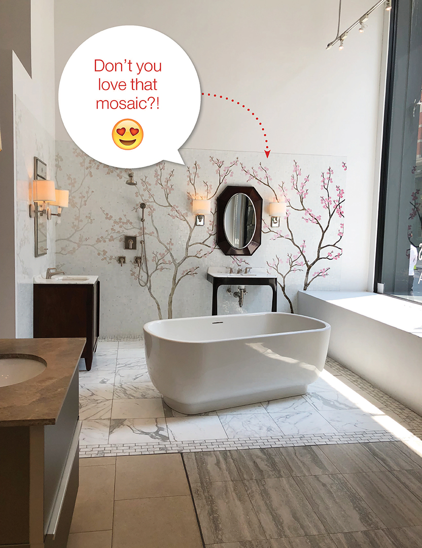 Bathroom with cherry tree mosaic wall and white stand alone bath