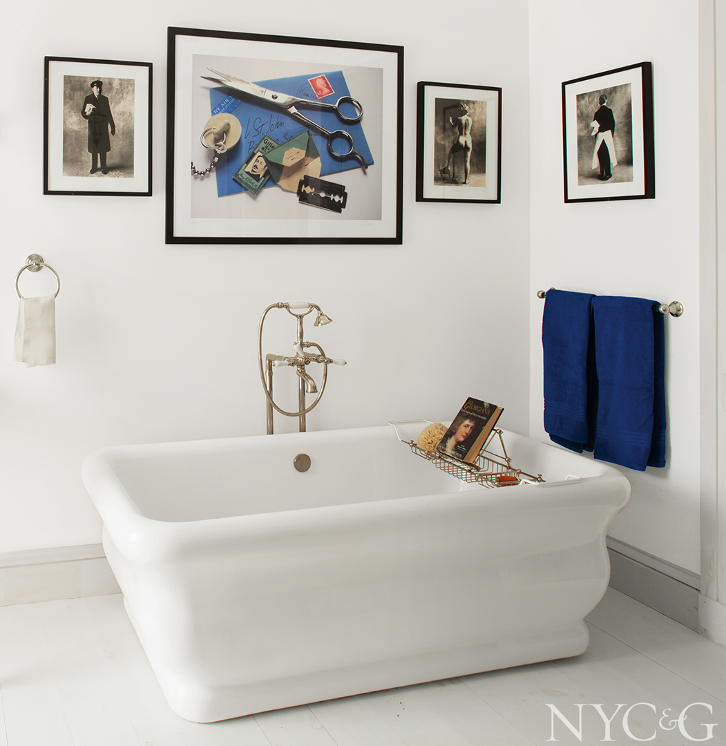 Splash of blue in all white guest bathroom